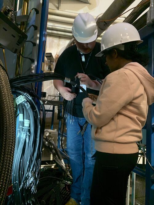 Aruni and Erik working on cables