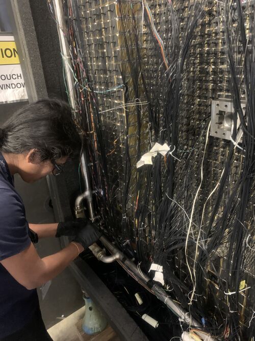 Aruni cleaning a HyCal module during fiber repairs.